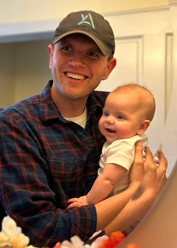 James holding his niece, Jane