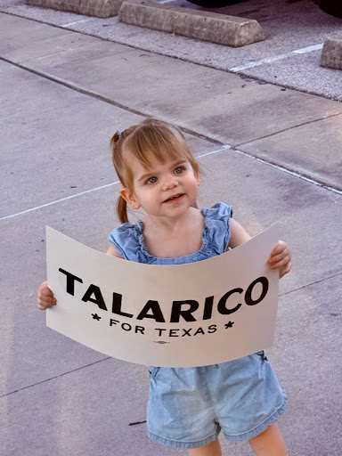 Jane holding a Talarico for Texas sign