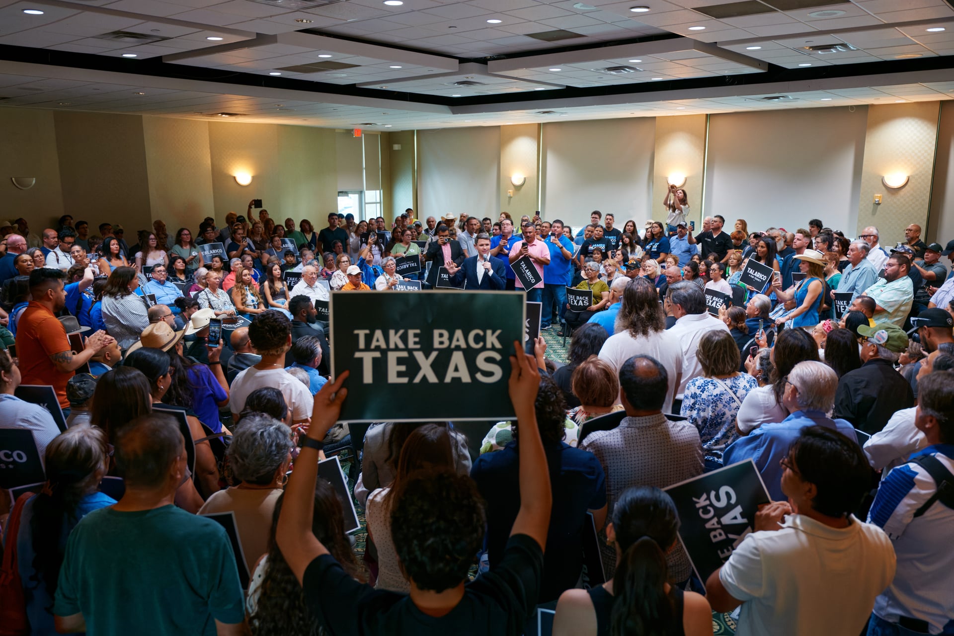 James and a large crowd at a town hall